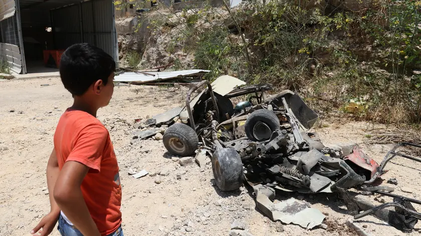 epa11391075 Vehicles damaged by an Israeli bulldozer during an Israeli army raid in Kafr Dan village, near the West Bank city of Jenin on 05 June 2024. Three Palestinians were injured in the Israeli army operation in the Jenin camp and Kaf Dan village, the Palestinian health ministry said. EPA/ALAA BADARNEH