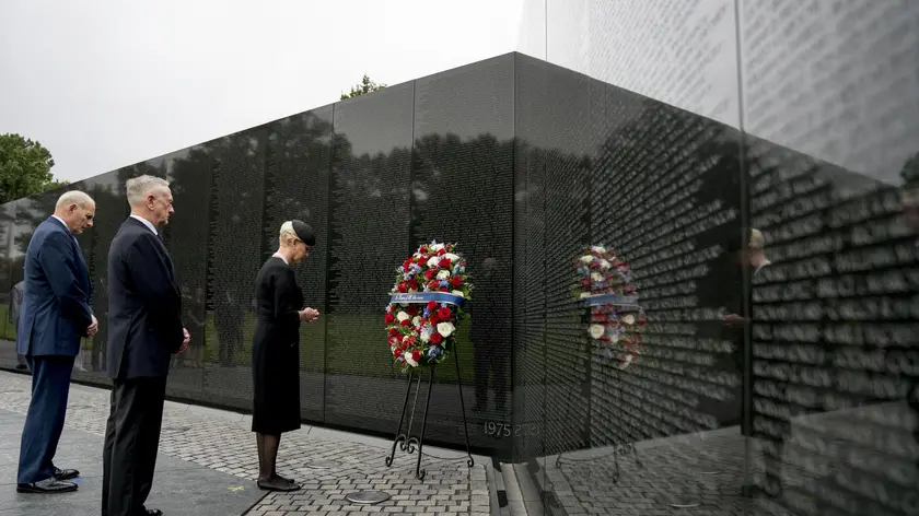 epa06989825 Cindy McCain, wife of, Sen. John McCain, R-Ariz., accompanied by President Donald Trump's Chief of Staff John Kelly (L), and Defense Secretary Jim Mattis (2-L) lays a wreath at the Vietnam Veterans Memorial in Washington, USA, 01 September 2018, during a funeral procession to carry the casket of her husband from the US Capitol to National Cathedral for a Memorial Service. McCain died 25 August 2018 from brain cancer at his ranch in Sedona, Arizona, USA. He was a veteran of the Vietnam War, served two terms in the US House of Representatives, and was elected to five terms in the US Senate. McCain also ran for president twice, and was the Republican nominee in 2008. EPA/ANDREW HARNIK / POOL