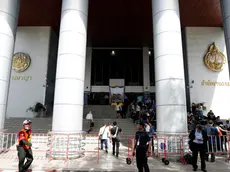 epa11419237 Security guards secure the area as journalists wait for the arrival of former Thai Prime Minister Thaksin Shinawatra during his arraignment to face charges of insulting the monarchy at Criminal Court in Bangkok, Thailand, 18 June 2024. The Criminal Court has released former Thai prime minister Thaksin Shinawatra on bail after he was indicted over 'lese majeste' crime charges allegedly for defaming the monarchy in his comments during an interview with South Korean newspaper on 21 May 2015. EPA/RUNGROJ YONGRIT