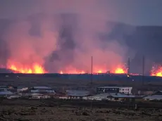 epaselect epa11077207 Lava explosions and rising smoke after a volcanic eruption near the town of Grindavik, in the Reykjanes peninsula, southwestern Iceland, 14 January 2024. A volcanic eruption began north of the town of Grindavík on the Reykjanes peninsula on 14 January, prompting authorities in Iceland to evacuate the small fishing town in the early morning as a precaution. The eruption is not expected to impact additional populated areas and does not present a 'threat to life', the Government of Iceland stated, adding that there are no disruptions to flights to and from Iceland. This is the second eruption in the area since December 2023, and the fifth since 2021. EPA/ANTON BRINK