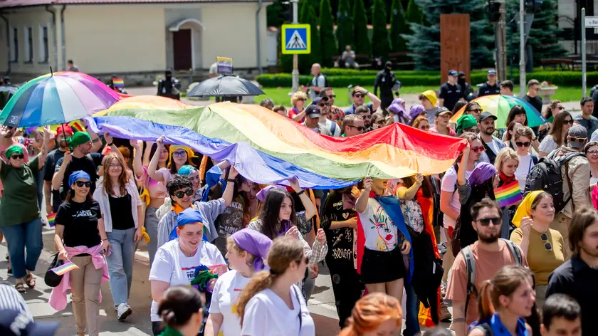 epa11415799 People attend the rally organized by the LGBTQIA+ (Lesbian, Gay, Bisexual, Transgender, Intersex, Queer/Questioning, Asexual) community, during their march for human rights and equality in Chisinau, Moldova, 16 June 2024. Moldovan police increased safety measures for the LGBT march after threats of possible violence were reported against the event. EPA/DUMITRU DORU