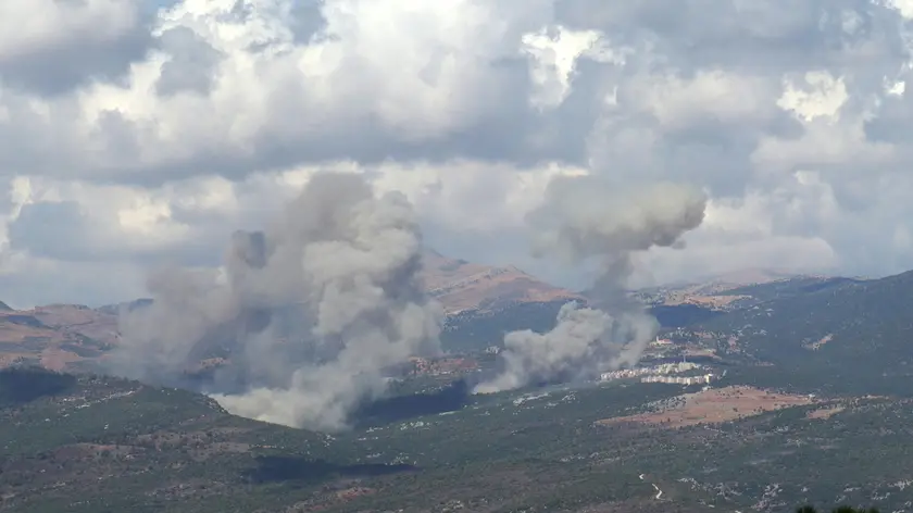 epa11617471 Smoke billows from the site of an Israeli airstrike that targeted southern Lebanese area, as seen fron Marjaayoun, southern Lebanon, 21 September 2024. The Israeli Defense Forces (IDF) said on 21 September they are 'striking targets belonging to the Hezbollah' in Lebanon. The strikes came one day after at least thirty-one people, including Hezbollah commander Ibrahim Akil, were killed and dozens injured in an attack which targeted the southern suburb of Beirut on 20 September, according to the Lebanese Ministry of Health. EPA/STR