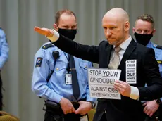epa09692476 Mass murder Anders Behring Breivik poses with a fascist salute as he arrives for the first day of the parole hearing of Anders Breivik, in Skien, Norway, 18 January 2022. Breivik, who changed his name to Fjotolf Hansen in 2017, is to appear before court for his three-days parole hearing in Oslo on 18 January 2022. Mass murderer Anders Behring Breivik was sentenced to a maximum term of 21 years for killing 77 people in bomb and shooting attacks on 22 July 2011, and is entitled under Norwegian law to have his sentenced reviewed after ten years served. The case is being processed by Telemark District Court, but is physically taking place in a makeshift courtroom in Skien prison. EPA/Ole Berg-Rusten / POOL NORWAY OUT NORWAY OUT