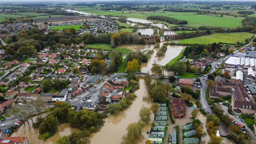 epa10949142 An aerial photograph taken with a drone of floodwater from the River Derwent in Stamford Bridge, Britain, 30 October 2023. Severe flood warnings are in place in parts of North Yorkshire following weeks of heavy rain brought by storms Agnes and Babet. The Meteorological Office is forecasting strong winds and heavy rain across southern England as Storm Ciaran is expected to arrive on 01 November. EPA/ADAM VAUGHAN
