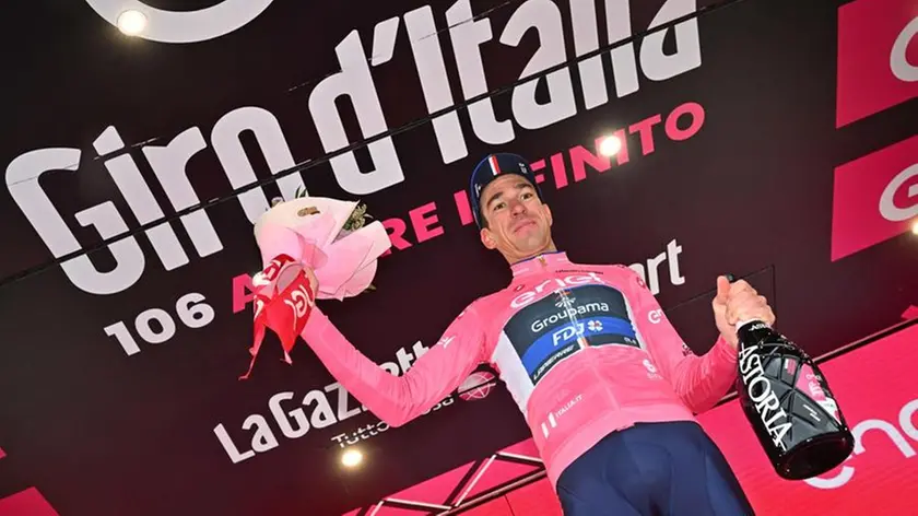 British rider Geraint Thomas of Team Ineos Grenadiers wearing the overall leader's pink jersey celebrates on the podium retaining the overall leader's pink jersey after the fourteenth stage of the 2023 Giro d'Italia cycling race over 193 km from Sierre to Cassano Magnago, Swiss, 20 May 2023. ANSA/LUCA ZENNARO