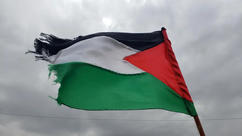 epa11302514 A Houthi supporter waves a Palestinian flag during a protest against the US and Israel, and in solidarity with the Palestinians, in Sana'a, Yemen, 26 April 2024. Thousands of Houthi supporters participated in a protest against the United States and Israel and to show their solidarity with the Palestinians of Gaza amid the ongoing conflict between Israel and Hamas. Yemen’s Houthis have claimed responsibility for fresh missile and drone attacks against vessels in the Red Sea and the Gulf of Aden and against the Israeli port city of Eilat after a few weeks of inactivity, according to a statement by Houthi military spokesman Yahya Sarea. The Houthis vowed to carry out more military operations against commercial ships until Israel ends the bombardment of the Gaza Strip. EPA/YAHYA ARHAB