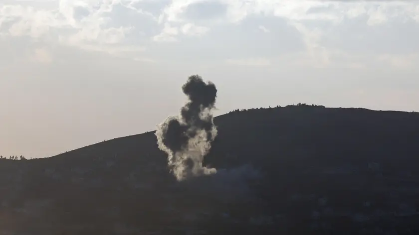 epa11612101 Smoke rises as a result of an Israeli airstrike on the southern Lebanese village of Kfar Kila, as seen from the Upper Galilee in northern Israel, 18 September 2024. The Israeli military stated that several missiles fired from Lebanon crossed into Israeli territory and were intercepted by the Iron Dome air defense system. EPA/ATEF SAFADI