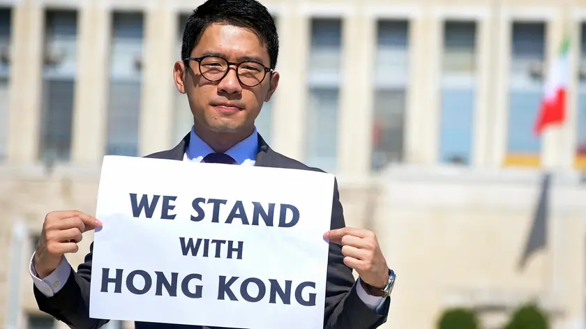 Exiled Hong Kong student activist Nathan Law, attends a protest outside Italian Ministry of Foreign Affairs askimg to be received by Foreign Minister Luigi Di Maio ahead a bilateral meeting with his counterpart from the People's Republic of China Wang Yi later in the day , Rome, Italy, 25 August 2020. Nathan Law is one of the best known among Hong Kong democracy activists, now in exile and one of six wanted abroad for alleged violation of the new National Security Law imposed by the Beijing regime on the population of Hong Kong. ANSA/RICCARDO ANTIMIANI