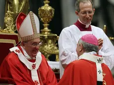 Monsignor Mario Aurelio Poli, Archbishop of Buenos Aires, Argentina, is greeted by Pope Francis after receiving the Pallium, a woolen shawl symbolizing his bond to the pope, during a mass in St. Peter's Basilica, at the Vatican, Saturday, June 29, 2013. (AP Photo/Gregorio Borgia)