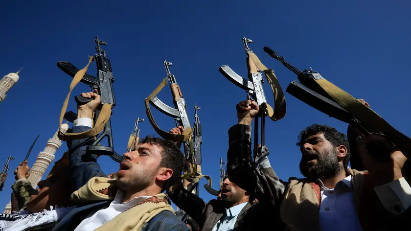 epa11396118 Houthi supporters chant slogans while holding up weapons during a protest against the US and Israel, and in solidarity with the Palestinian people, in Sana'a, Yemen, 07 June 2024. Thousands of Houthi supporters participated in a protest in support of the Palestinian people and condemning the US support of Israeli actions in Gaza. The protest came a day after Yemen's Houthis claimed to have launched two joint drone attacks with an Iraqi militia group against ships at Israel's Haifa port, in retaliation for the Israeli military operations in Gaza, vowing to keep up maritime attacks in solidarity with Palestinians, according to a statement by Houthi military spokesman Yahya Sarea. EPA/YAHYA ARHAB