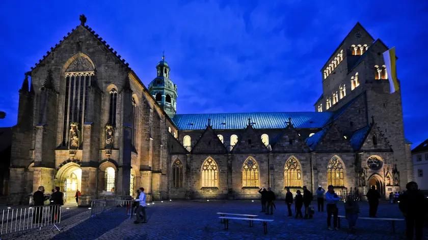 epa04355599 The Cathedral Church of the Assumption is illuminated during its reopening in Hildesheim (Lower Saxony), Germany, 15 August 2014. The renovation works took five years and received 37.2 million euros from the Catholic Church, the EU, and the federal government and donations. EPA/Ole Spata