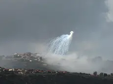 epaselect epa11198500 Smoke rises from the Lebanese village of Markaba as a result of Israeli shelling in southern Lebanon, next to the Israeli moshav of Margaliot at the border with Israel, 04 March 2024. The Israeli military stated on 04 March that following fire crossing from Lebanon into the area of Margaliot in northern Israel a number of civilians were injured and evacuated to receive medical treatment. According to an Israeli army spokesperson, one person was killed, two others were seriously injured and five reported mild to moderate injuries. Israel said it struck the source of the launch in southern Lebanon. EPA/ATEF SAFADI
