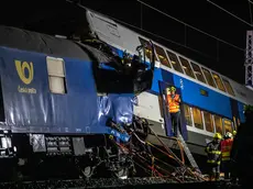 epaselect epa08546514 Firefighters work in the aftermath of a train crash near the city of Cesky Brod, Czech Republic, 15 July 2020. According to media reports, at least one person died and 35 people were injured after a cargo and a passenger train collided between Uvaly and Cesky Brod. EPA/MARTIN DIVISEK