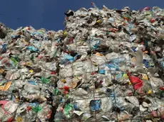 BERLIN, GERMANY - AUGUST 15: Bales of sorted plastic, much of it from drin containers, stand at the ALBA sorting center for the recycling of packaging materials on August 15, 2017 in Berlin, Germany. The facility sorts plastics, metals, films, wrappers, drink cartons and other waste people in Berlin discard as trash into recyclable raw materials that can later be used in industry and manufacturing. (Photo by Sean Gallup/Getty Images)