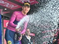 Italian rider Jonathan Milan of Lidl-Trek team retaining the points classification leader's cyclamen jersey, celebrate on the podium after 20th stage of the 107 Giro d'Italia 2024, cycling race over 184 km from Alpago to Bassano del Grappa, Italy, 25 May 2024. ANSA/LUCA ZENNARO