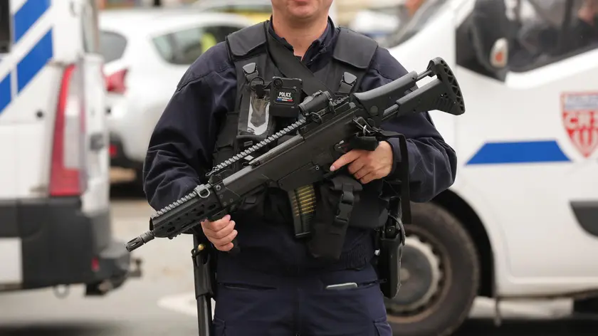 epa10916956 A police officer guards the high school in Arras, northeastern France, 13 October 2023, after a teacher was killed and two other people severely wounded in a knife attack, police said. The suspect has been detained by police, Interior Minister Gerald Darmanin said. French President Macron is expected to visit the site. EPA/Teresa Suarez