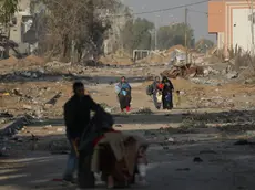 epa10993182 Palestinians walk after crossing from the northern Gaza Strip to the southern Gaza Strip along Salah Al Din road in the central Gaza Strip, 24 November 2023. After Israel and Hamas agreed to a four-day ceasefire, mediated by Qatar, the US, and Egypt, that came into effect at 05:00 AM GMT on 24 November, some Palestinians who were still in central Gaza moved towards the south while others already displaced in the south went back to the northern part to check on relatives they had left behind and on their homes to collect salvageable belongings. As part of the ceasefire, the agreement included that 50 Israeli hostages, women and children, are to be released by Hamas. 150 Palestinian women and children that were detained in Israeli prisons are to be released in exchange. More than 14,000 Palestinians and at least 1,200 Israelis have been killed, according to the Gaza Government media office and the Israel Defense Forces (IDF), since Hamas militants launched an attack against Israel from the Gaza Strip on 07 October, and the Israeli operations in Gaza and the West Bank which followed it. EPA/MOHAMMED SABER