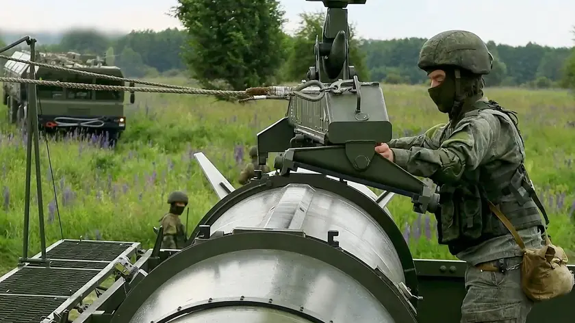 epa11407646 A still image taken from a handout video made available by the Russian Defence Ministry press-service shows Russian servicemen operating a non-strategic nuclear missile for Iskander operational-tactical missile system during the second stage of tactical nuclear drills of Russian and Belarus armed forces at an undisclosed location, 13 June 2024. In accordance with the decision of the President of the Russian Federation, the second stage of the exercise of non-strategic nuclear forces has begun. The exercises are aimed at maintaining the readiness of personnel and equipment of units for the combat use of non-strategic nuclear weapons of Russia and Belarus, the Russian Ministry of Defense said. EPA/RUSSIAN DEFENCE MINISTRY PRESS S HANDOUT HANDOUT EDITORIAL USE ONLY/NO SALES HANDOUT EDITORIAL USE ONLY/NO SALES