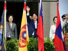epa11354531 (L-R) Outgoing Taiwan president Tsai Ing-wen, Taiwan President William Lai and Vice President Hsiao Bi-khim, waves to the crowd during the Taiwan Presidential Inauguration, in Taipei, Taiwan, 20 May 2024. William Lai (Lai Ching-te) becomes Taiwan's 16th president on 20 May, taking over incumbent Tsai Ing-wen. EPA/RITCHIE B. TONGO