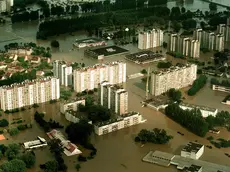 Aerial view taken 11 July showing a flooded residential district in Opole, southern Poland. The death toll in Poland resulting from devastating floods which have swept central Europe for a week, has gone up to 23. Torrential rains which stopped Thursday have left 50 towns and some 300 villages under water in Poland.
