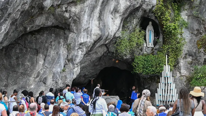 epa10801611 People attend the feast of the Assumption of the Virgin and the 150th anniversary of the French national pilgrimage in Lourdes, southwestern France, 15 August 2023. 150 years ago, the church confirmed the visions of Bernadette Soubirous. On 18 January 1862, the Church authenticated the 18 apparitions of the Virgin at Lourdes, recounted by Bernadette Soubirous, opening the way to demonstrations of piety now followed each year by some six million pilgrims. EPA/CAROLINE BLUMBERG