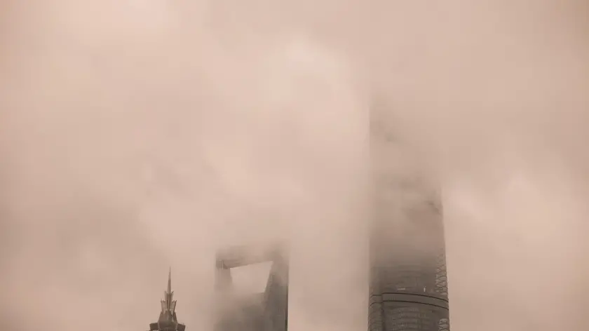 epa11607729 Lujiazui financial district skyline is seen during the heavy wind and rain amid Typhoon Bebinca in Shanghai, China, 16 September 2024. Shanghai, China's financial hub, closed its seaports and canceled over 600 flights in preparation for Typhoon Bebinca, the strongest tropical storm to hit the city in 75 years. More than 377,000 people were evacuated, and the Mid-Autumn Festival's mood has been dampened by the potential for up to 10 inches (25 cm) of rain. EPA/ALEX PLAVEVSKI