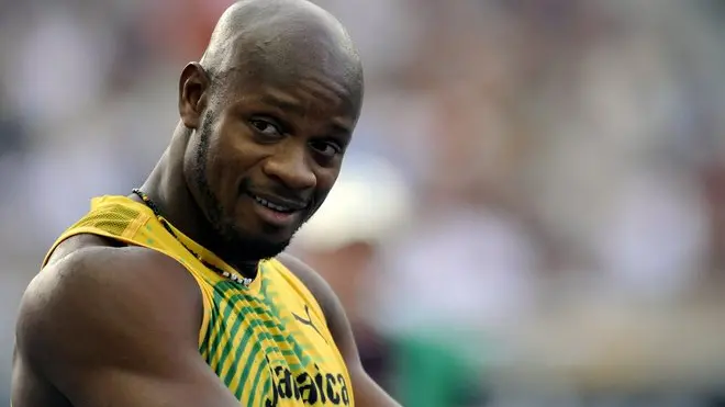 epa01824804 Asafa Powell of Jamaica waits for the start in the 100m heat at the 12th IAAF World Championships in Athletics, Berlin, Germany, 15 August 2009. EPA/HANNIBAL