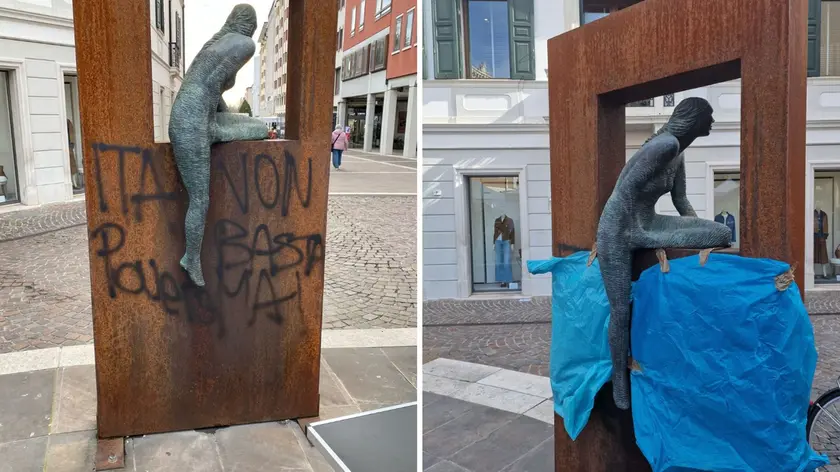 Scritte sulla scultura di Bruno Lucchi in piazzetta Cavour, coperta poi con dei teloni blu in attesa di essere ripulite