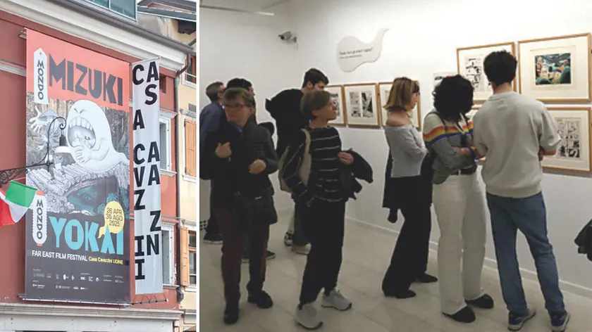 La facciata di Casa Cavazzini dedicata a Mizuki e i visitatori tra i pannelli della mostra