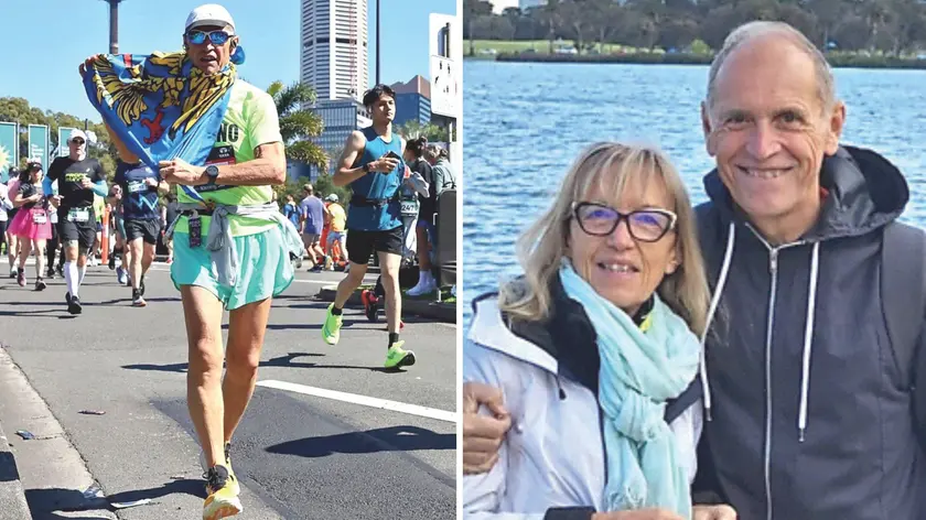 Romano Jus alla maratona di Sydney con la bandiera del Friuli, a destra con la moglie