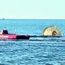 Ombrelloni e tavoli recuperati in mare dai bagnini dopo la festa della Pentecoste a Lignano