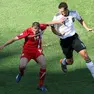 Germany's Miroslav Klose (R) and Serbia's Milan Jovanovich (L) during the FIFA World Cup 2010 group D preliminary round match between Germany and Serbia at the Nelson Mandela Bay stadium in Port Elizabeth, South Africa, 18 June 2010.