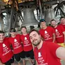 Il gruppo di otto amici in cima a un campanile in occasione di un’esibizione