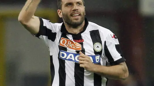 Udinese defender Maurizio Domizzi, right, celebrates after scoring during the Serie A soccer match between Inter Milan and Udinese at the San Siro stadium in Milan, Italy, Sunday, May 19, 2013. (AP Photo/Antonio Calanni)