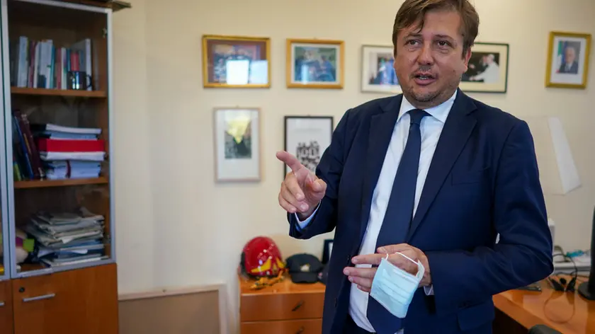 Deputy Minister of Health Pierpaolo Sileri talks during an interview with the Associated Press, in Rome, Wednesday, Aug. 26, 2020. Sileri said that widespread swab-testing and flexibility to quickly shutdown classes or schools with clusters is the key to school reopening. (AP Photo/Andrew Medichini)