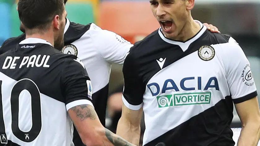 Udinese's Kevin Lasagna (R) jubilates with his teammate Rodrigo De Paul after scoring the goal during the Italian Serie A soccer match Udinese Calcio vs SSC Napoli at the Friuli - Dacia Arena stadium in Udine, Italy, 10 January 2021. ANSA/GABRIELE MENIS