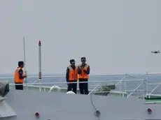 epa10903658 A handout picture made available by the Philippine Coast Guard (PCG) shows Chinese coastguard personnel on board a Chinese Coast Guard ship launching a drone in the disputed South China Sea on 04 October 2023 (issued on 06 October 2023). In a statement issued by Philippine Coast Guard (PCG) spokesperson for the West Philippine Sea Commodore, Jay Tarriela, on 06 October, the Philippine government strongly condemned the Chinese ship's dangerous maneuvers particularly the near collision with Philippine coast guard ship conducting a rotation and re-supply mission. China and the Philippines are engaged in a territorial dispute over the sovereignty of several islands and atolls in the South China Sea. EPA/Philippine Coast Guard / HANDOUT HANDOUT EDITORIAL USE ONLY/NO SALES