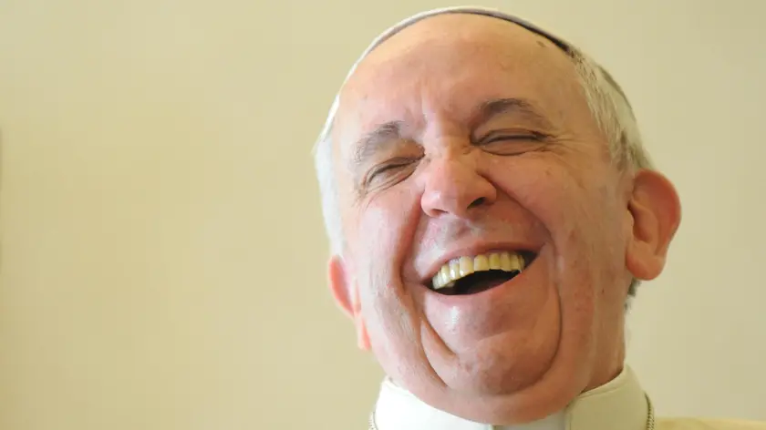 Pope Francis laughs during a private audience with the Prime Minister of Saint Vincent and the Grenadines at the Vatican on 19 December 2013 ANSA/POOL/AFP/TIZIANA FABI