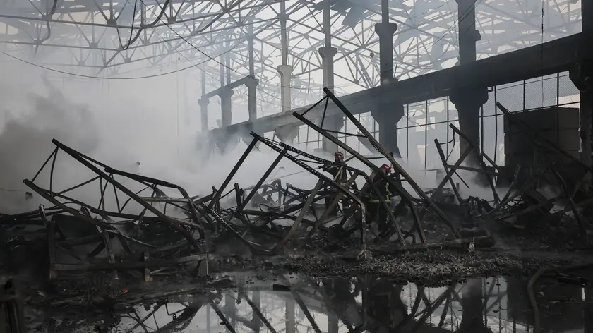 epa11047967 Ukrainian rescuers work at the site of a rocket attack on a civilian warehouse in Kyiv (Kiev), Ukraine, 29 December 2023, amid the Russian invasion. At least 16 people have died and dozens more injured after Russia launched a wave of airstrikes across Ukraine, Ukrainian authorities said on 29 December. Strikes were reported in Kyiv, Lviv, Odesa, Dnipro, Kharkiv, Zaporizhzhia, and other Ukrainian cities. Russia launched 'more than 150 missiles and combat drones' at Ukrainian cities, Ukraine's Prosecutor General Andriy Kostin said in a statement, adding that extensive damage included residential buildings, educational institutions and hospitals. Russian troops entered Ukraine on 24 February 2022 starting a conflict that has provoked destruction and a humanitarian crisis. EPA/OLEG PETRASYUK