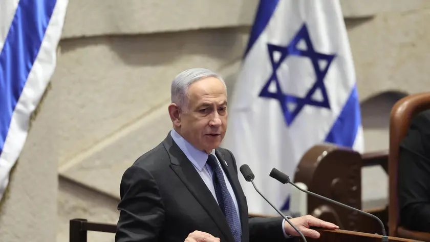 epa11166728 Israeli Prime Minister Benjamin Netanyahu speaks during the voting session for the impeachment of Hadash-Ta’al party MP Ofer Cassif in Jerusalem, 19 February 2024. The motion was brought up after Cassif publicly supported South Africa’s genocide case against Israel at the International Court of Justice (ICJ). EPA/ABIR SULTAN
