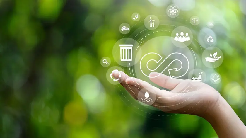 circular economy symbol on hand icon with an endless circular economy in the concept of sustainable business and environmental growth in the future