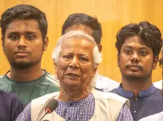 epa11537708 Nobel laureate Muhammad Yunus (C), surrounded by quota protests student leaders, speaks to the media after arriving in Dhaka at Hazrat Shahjalal International Airport, in Dhaka, Bangladesh, 08 August 2024. Yunus was sworn in as the head of Bangladesh's interim government on 08 August after former prime minister Sheikh Hasina had resigned and fled the country amid violent protests over the government's job quota system. EPA/MONIRUL ALAM