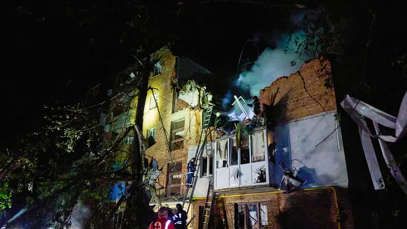 epa11381051 Ukrainian rescuers working at the site of the shelling of a residential building in Kharkiv, Ukraine, 31 May 2024 amid the Russian invasion. At least 5 people died and 25 were wounded in the overnight rocket attack on the residential area according to the report of the head of the Kharkiv Military Administration Oleg Synegubov. Russian troops entered Ukrainian territory on 24 February 2022, starting a conflict that has provoked destruction and a humanitarian crisis. EPA/SERGEY KOZLOV