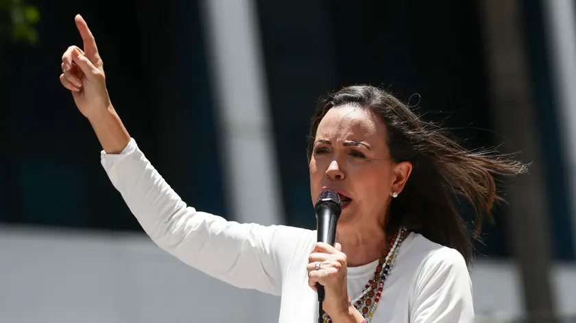 epa11569659 Venezuelan opposition leader Maria Corina Machado gives a speech to supporters at a rally in Caracas, Venezuela, 28 August 2024. Machado said that 'not a single democratic government in the world has recognized' the re-election of Nicolas Maduro, whose victory in the July 28 presidential election she considers a 'fraud', as does a large part of the international community. EPA/RONALD PENA