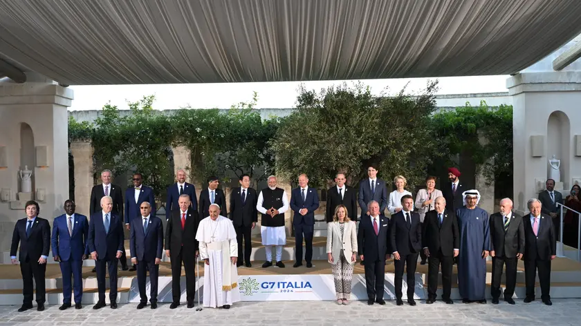 Pope Francis poses for a family photo with G7 heads of States and heads of delegation of Outreach countries at Borgo Egnazia resort during the G7 Summit hosted by Italy in Apulia region, on June 14, 2024 in Savelletri. ANSA/CIRO FUSCO