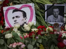 epa11163497 Portraits of deceased Alexei Navalny are positioned between flowers during a rally in reaction to the death of Russian opposition leader Alexei Navalny in front of the Russian embassy, in Berlin, Germany, 18 February 2024. Russian opposition leader and outspoken Kremlin critic Alexei Navalny has died aged 47 in a penal colony, the Federal Penitentiary Service of the Yamalo-Nenets Autonomous District announced on 16 February 2024. A prison service statement said that Navalny 'felt unwell' after a walk on 16 February, and it was investigating the causes of his death. In late 2023 Navalny was transferred to an Arctic penal colony considered one of the harshest prisons. EPA/CLEMENS BILAN