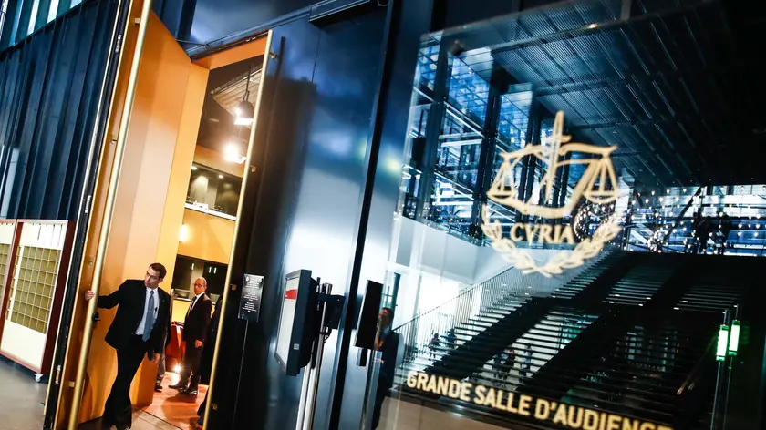 epa10066472 A guard closes the door of the Grand Salle inside the Court of Justice of the European Union (CJEU) in Luxembourg, 12 July 2022, after a break in the hearing of the European Super League case. In April 2021 Barcelona, Juventus and Real Madrid, three of the original twelve founding members of the European Super League, won a ruling by a Spanish court that the clubs could not be punished by the UEFA or FIFA for setting up the league. The court in Madrid referred the case to the CJEU. The three clubs, representing European Super League Company, S.L., claim that UEFA and FIFA abuse their dominant position and act against EU competition law. EPA/MOHAMMED BADRA