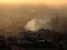 epa10981927 Smoke rises over Balata Refuge Camp during an Israeli raid on the camp, near Nablus, the West Bank, 18 November 2023. According to the Palestinian Red Crescent, five people were killed and two injured in an Israeli strike on a building in the West Bank's Balata refugee camp near Nablus. The camp's administration said an aerial strike targeted the local headquarters of the Palestinian group Fatah. EPA/ALAA BADARNEH