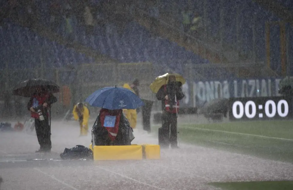 Photographers are seen during an heavy rain prior to the Serie A Soccer match SS Lazio vs Udinese Calcio at Olimpico Stadium in Rome, 05 November 2017. The start of the match is postponed due to heavy rain. ANSA/CLAUDIO PERI