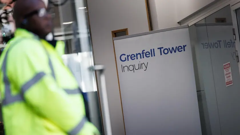 epa11583646 A security guard stands outside the Grenfell Inquiry at Dorland House in London, Britain, 04 September 2024. The Grenfell Inquiry Phase 2 was published on 04 September 2024. It examined the conditions that allowed the fire to spread at the 24-storey Grenfell Tower apartment block on 14 June 2017, claiming the lives of 72 people. EPA/TOLGA AKMEN